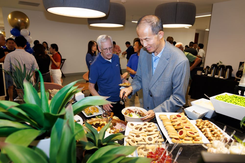 The luncheon reception envelops the hall with an enticing aroma.